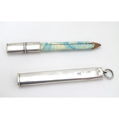 199 - A silver pencil holder hallmarked Chester 1909 maker E Baker & Son. 3 1/4'' long