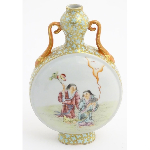 20 - A Chinese twin handled moon vase decorated on one side with a lady and a frog, and two figures on th... 