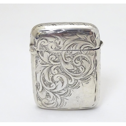 201 - A silver vesta case with engraved decoration hallmarked Birmingham 1896 maker Rolason Brothers 1 3/4... 