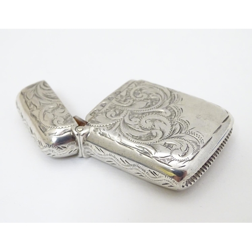 201 - A silver vesta case with engraved decoration hallmarked Birmingham 1896 maker Rolason Brothers 1 3/4... 