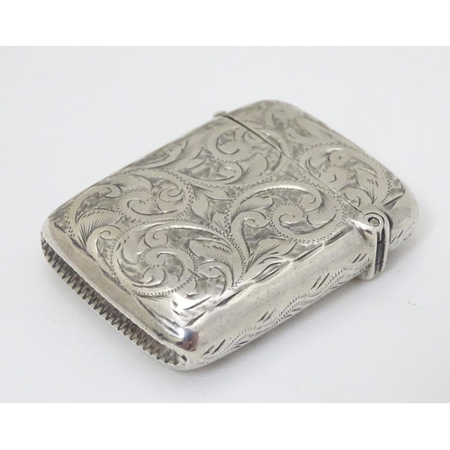 201 - A silver vesta case with engraved decoration hallmarked Birmingham 1896 maker Rolason Brothers 1 3/4... 