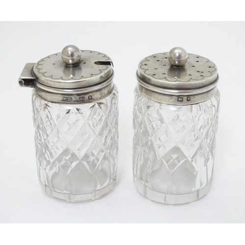 202 - Cut glass pepper pot and mustard pot with silver tops hallmarked  Birmingham 1906 maker William Deve... 