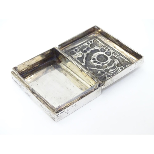 204 - A white metal box of rectangular form with hinged lid.  1 3/4'' x 1 1/4'' x 3/8''