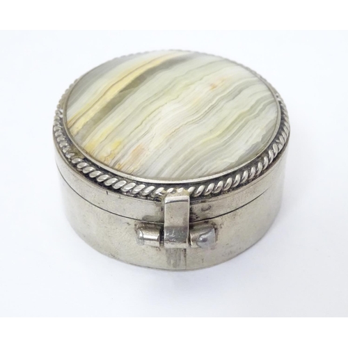 206 - A silver plate box of circular form set with agate / onyx hardstone to lid. 1 3/4'' diameter