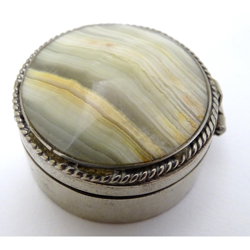 206 - A silver plate box of circular form set with agate / onyx hardstone to lid. 1 3/4'' diameter