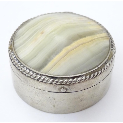 206 - A silver plate box of circular form set with agate / onyx hardstone to lid. 1 3/4'' diameter