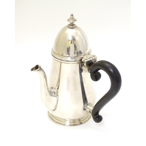 209 - A silver chocolate pot with ebonised handle hallmarked London 1926 maker Goldsmiths & Silversmiths C... 