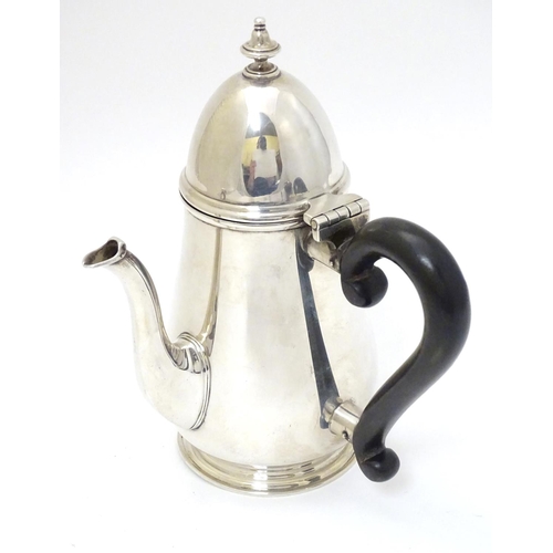 209 - A silver chocolate pot with ebonised handle hallmarked London 1926 maker Goldsmiths & Silversmiths C... 