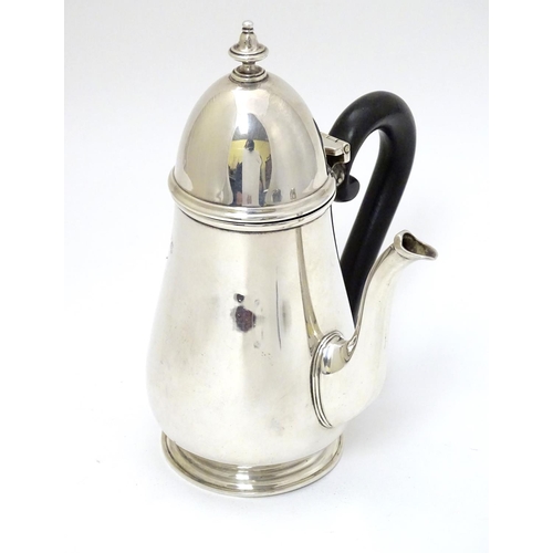 209 - A silver chocolate pot with ebonised handle hallmarked London 1926 maker Goldsmiths & Silversmiths C... 