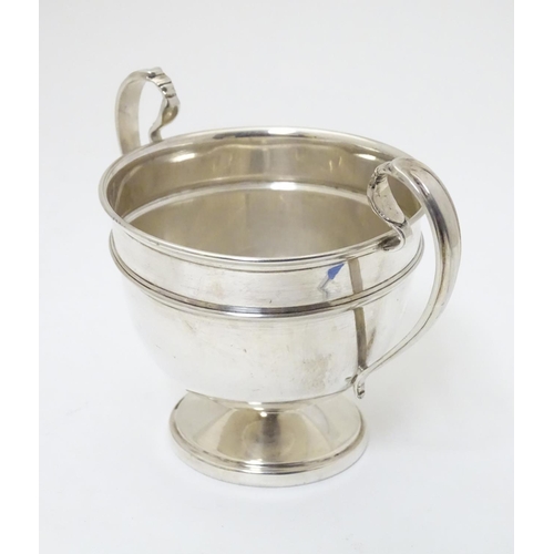 210 - A twin handled trophy cup hallmarked London 1932 maker Sir John Bennett Ltd. (126g)