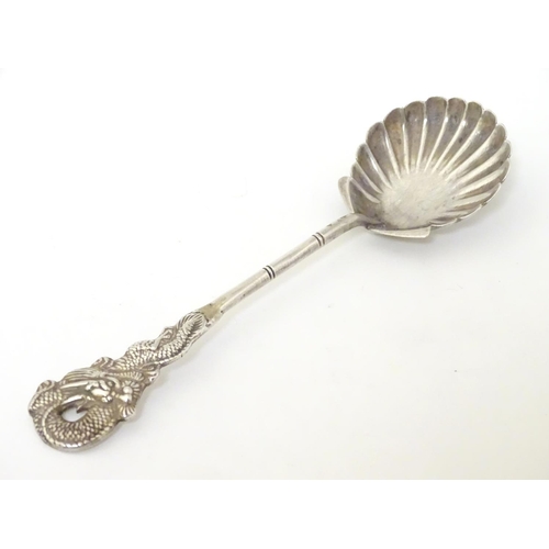 212 - Chinese Export Silver : A Sterling silver preserve spoon with shell formed bowl and dragon decoratio... 