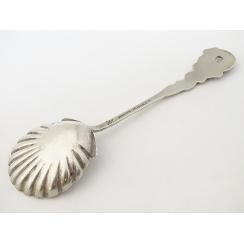 212 - Chinese Export Silver : A Sterling silver preserve spoon with shell formed bowl and dragon decoratio... 