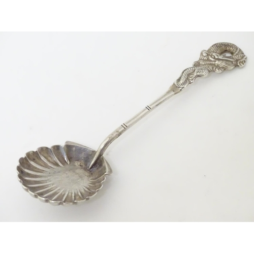 212 - Chinese Export Silver : A Sterling silver preserve spoon with shell formed bowl and dragon decoratio... 