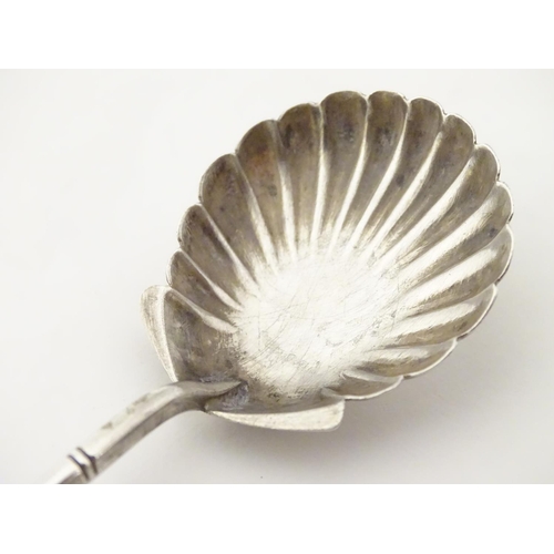 212 - Chinese Export Silver : A Sterling silver preserve spoon with shell formed bowl and dragon decoratio... 