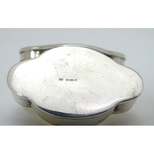 215 - A silver pill box of shaped form with hinged lid and engraved decoration. Marked for Mark Houghton L... 