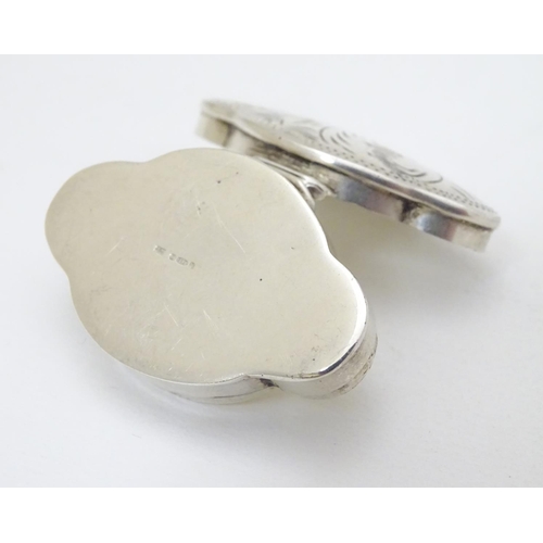 215 - A silver pill box of shaped form with hinged lid and engraved decoration. Marked for Mark Houghton L... 