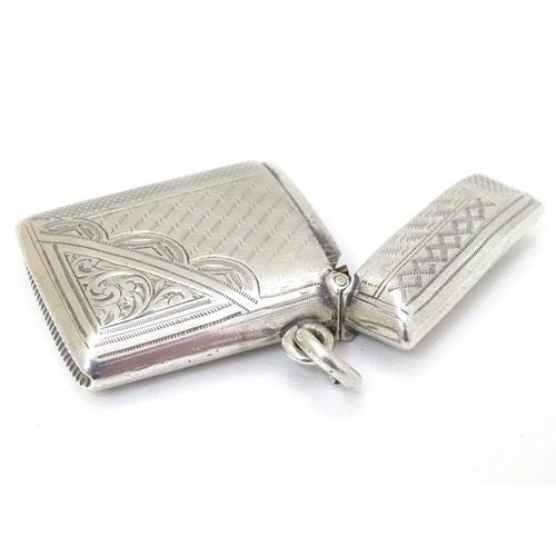 218 - A silver vesta case with engraved decoration. Hallmarked  Birmingham 1902 maker E J Houlston 2'' hig... 