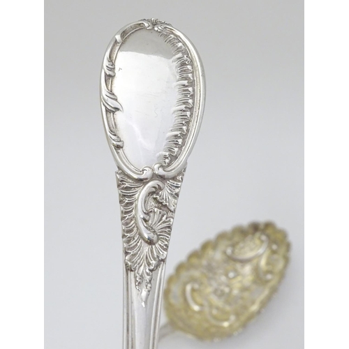 219 - A pair of embossed silver berry spoons hallmarked Sheffield 1906 maker Mappin & Webb Ltd. 9'' long (... 