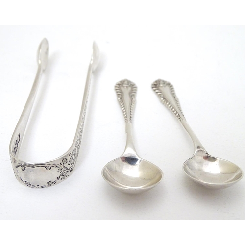 226 - A pair of silver salt spoons hallmarked London 1969 maker Richards & Knight.  Together with sugar to... 