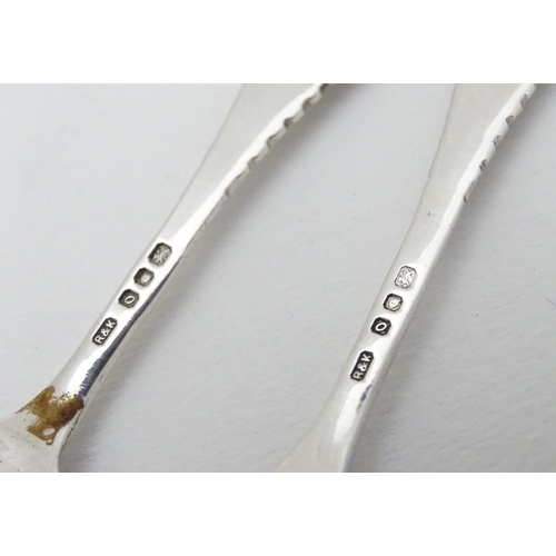 226 - A pair of silver salt spoons hallmarked London 1969 maker Richards & Knight.  Together with sugar to... 