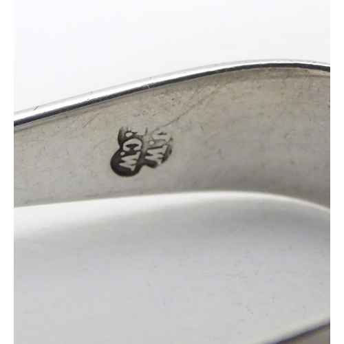 226 - A pair of silver salt spoons hallmarked London 1969 maker Richards & Knight.  Together with sugar to... 