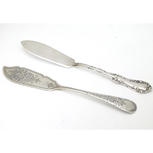 228 - 2 silver butter knives one hallmarked Sheffield 1905 maker W S Savage & Co. The other Birmingham 189... 