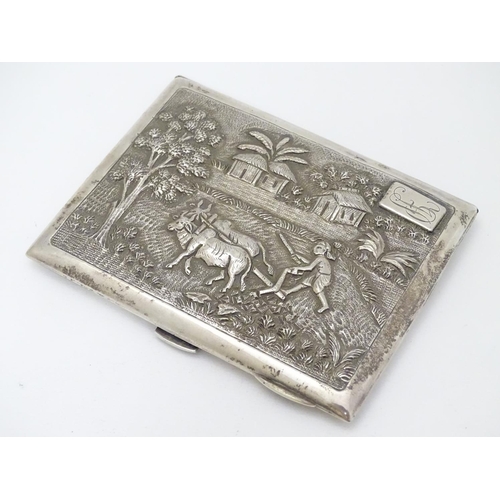 229 - A Sterling silver cigarette case with decoration to lid depicting figure and oxen ploughing the fiel... 