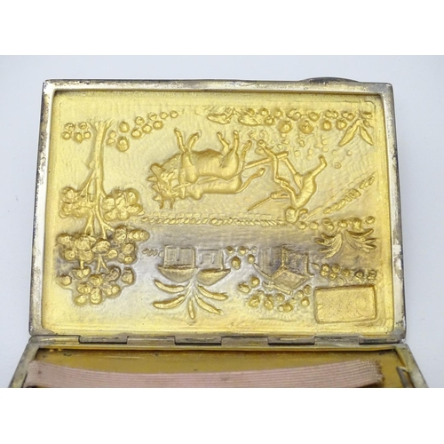 229 - A Sterling silver cigarette case with decoration to lid depicting figure and oxen ploughing the fiel... 