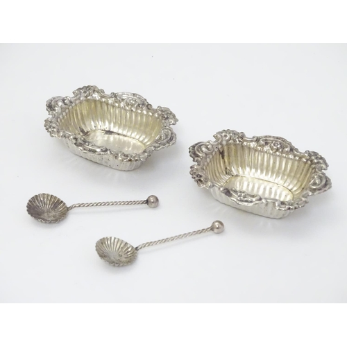 231 - A pair of silver salts hallmarked Chester 1900 together with a pair of salt spoons hallmarked 1901 m... 