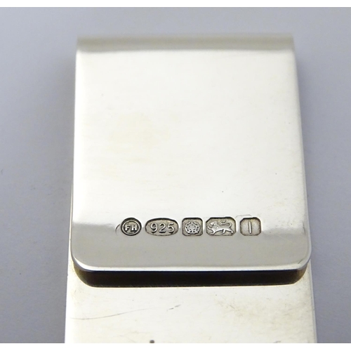 232 - A silver money clip hallmarked Sheffield 2010 maker Francis Howard Ltd. 3'' long (14g)