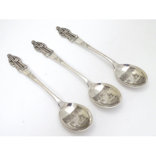 235 - An unusual set of 3 silver apostle spoons the bowls decorated with scenes within a shield cartouche ... 