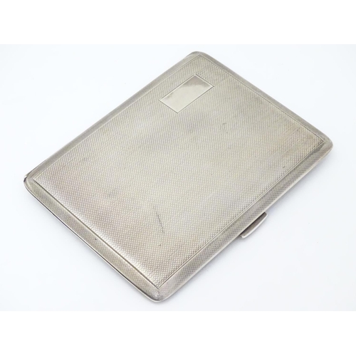 236 - An Art Deco silver cigarette case with engine turned decoration. Hallmarked Birmingham 1940 maker E ... 