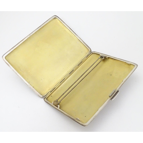 236 - An Art Deco silver cigarette case with engine turned decoration. Hallmarked Birmingham 1940 maker E ... 