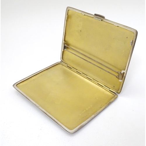 236 - An Art Deco silver cigarette case with engine turned decoration. Hallmarked Birmingham 1940 maker E ... 