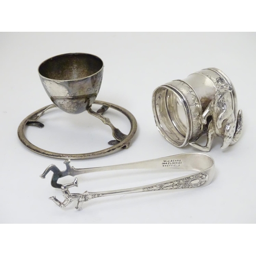 238 - c1901 Silver plated sugar tongs, the grips formed as three running legs ( Isle of Mann emblem) and m... 