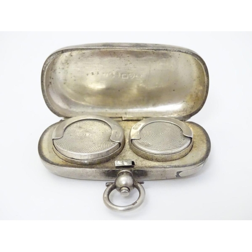 240 - A silver sovereign case / carrier of oblong form opening to reveal provision for sovereign and half ... 