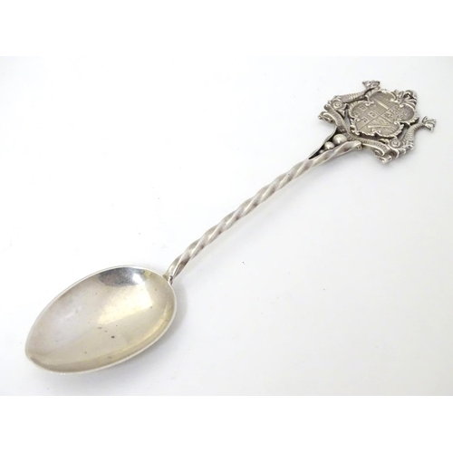 255 - A silver souvenir spoon with crest to handle titled Ilfracombe.  Hallmarked Chester 1904 maker  John... 