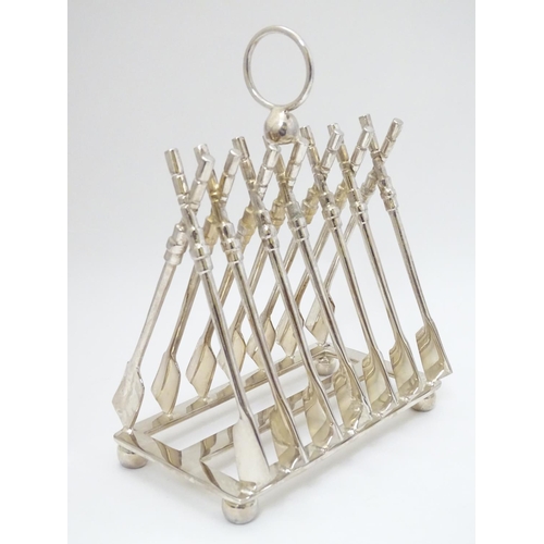 265 - Assorted items comprising a silver plate novelty - slice toast rack, the divisions formed as rowing ... 