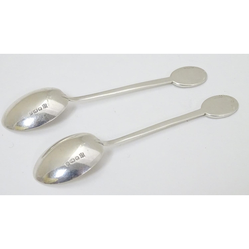 270 - A pair of silver teaspoons marked RNLI to handles and with crossed golf club detail. Hallmarked Shef... 