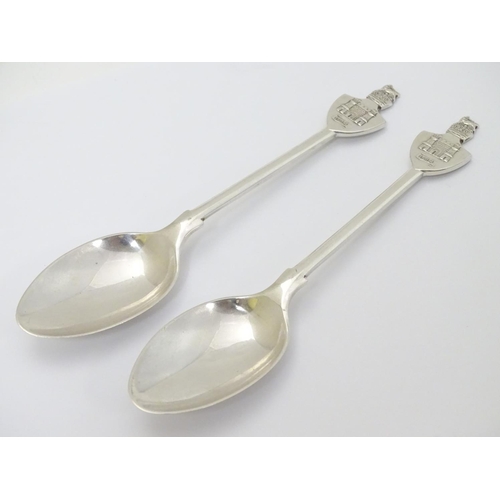 272 - A pair of commemorative silver teaspoons, the handles surmounted by castles titled 1614. Hallmarked ... 