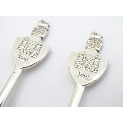 272 - A pair of commemorative silver teaspoons, the handles surmounted by castles titled 1614. Hallmarked ... 