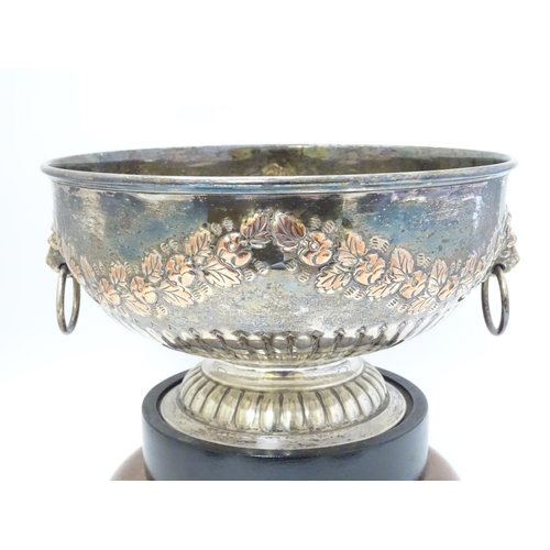 274 - A silver plate pedestal bowl with floral swag decoration and lions mask handle. 10 1/2'' wide