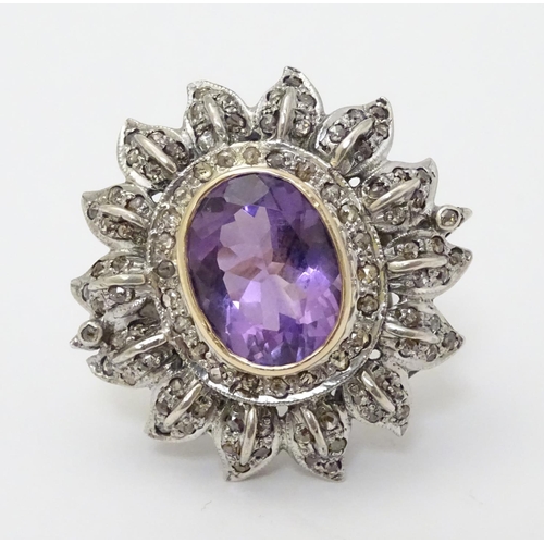 279 - An impressive 18ct gold cocktail ring set with large central oval amethyst approx 6.50ct bordered by... 