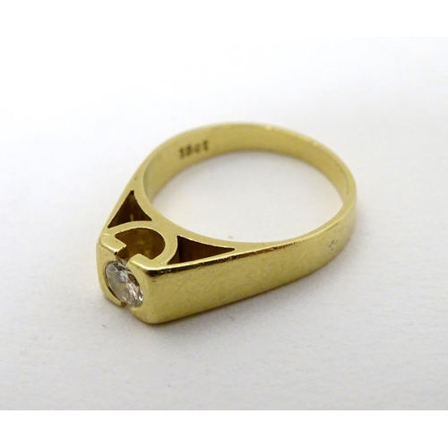 290 - An 18ct gold diamond solitaire ring, the diamond approx 0.25ct. In a modernist setting