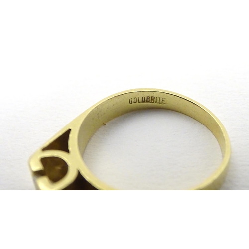 290 - An 18ct gold diamond solitaire ring, the diamond approx 0.25ct. In a modernist setting