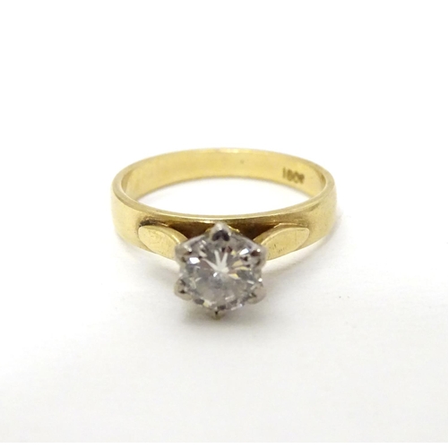 291 - An 18ct gold diamond solitaire ring. the diamond approx 0.50ct