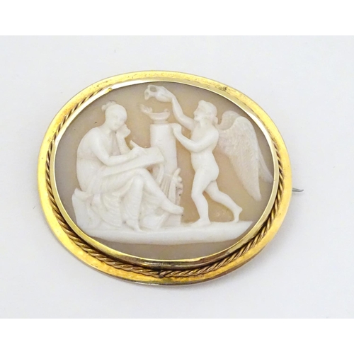 297 - A Victorian shell carved cameo brooch depicting classical scene with Cupid like cherub and a muse,  ... 