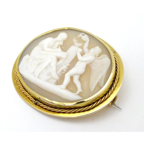 297 - A Victorian shell carved cameo brooch depicting classical scene with Cupid like cherub and a muse,  ... 