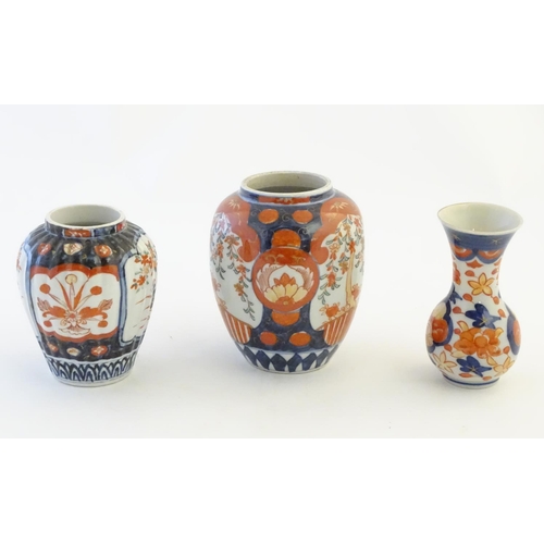 30 - Three Imari vases decorated with panelled floral designs. Largest approx. 5'' high (3)