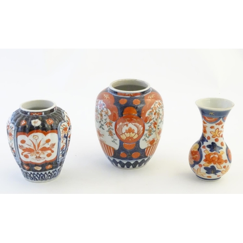 30 - Three Imari vases decorated with panelled floral designs. Largest approx. 5'' high (3)